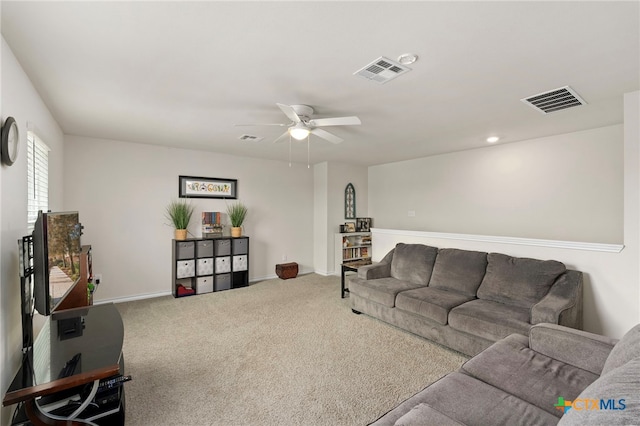 living room with carpet, visible vents, ceiling fan, and baseboards