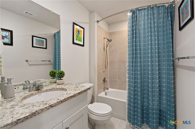 full bath with visible vents, toilet, shower / tub combo, vanity, and tile patterned floors