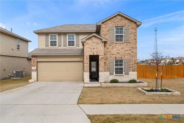 traditional-style house with central AC unit, a garage, brick siding, fence, and concrete driveway