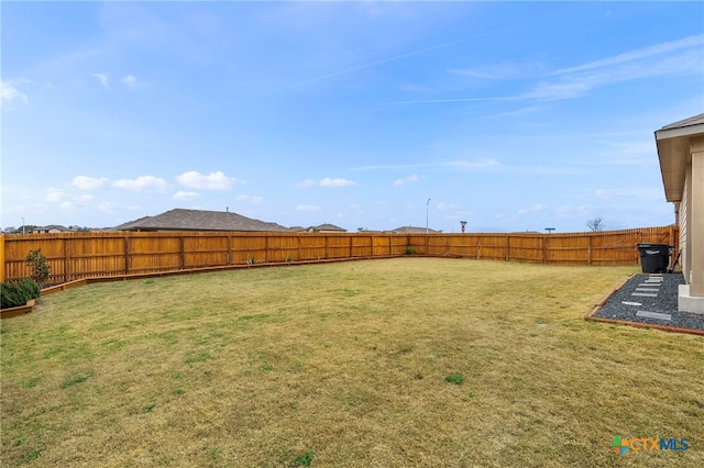 view of yard featuring a fenced backyard