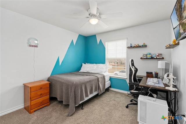 carpeted bedroom featuring ceiling fan and baseboards