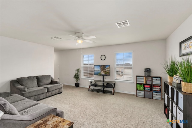 living room featuring ceiling fan, carpet floors, visible vents, and baseboards