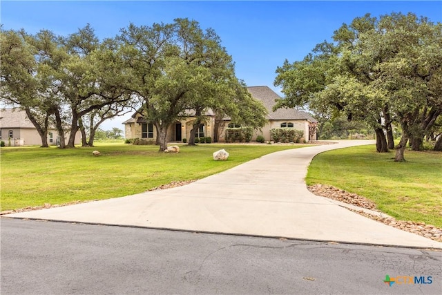 2718 Beaver Ln, New Braunfels, TX 78132 - view of front facade featuring driveway and a front yard