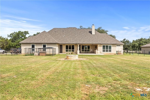 2718 Beaver Ln, New Braunfels, TX 78132 - rear view of house featuring stucco siding, a lawn, a chimney, and fence