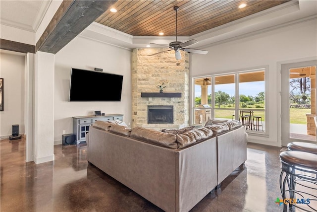 2718 Beaver Ln, New Braunfels, TX 78132 - living room featuring baseboards, ceiling fan, ornamental molding, wood ceiling, and a raised ceiling