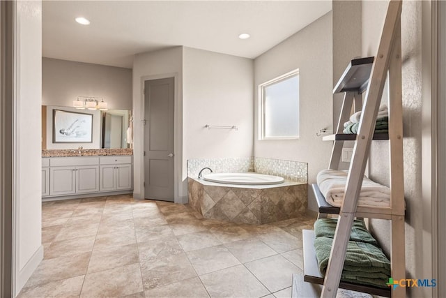 2718 Beaver Ln, New Braunfels, TX 78132 - bathroom featuring tile patterned floors, recessed lighting, vanity, and a garden tub