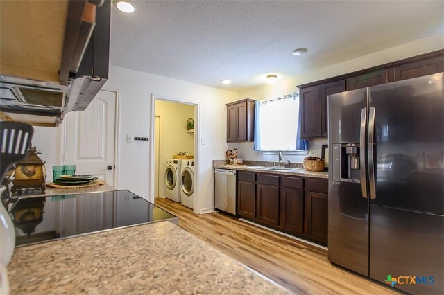 7202 Bose Ikard Dr, Killeen, TX 76549 - kitchen featuring stainless steel appliances, separate washer and dryer, light wood-style floors, dark brown cabinets, and recessed lighting