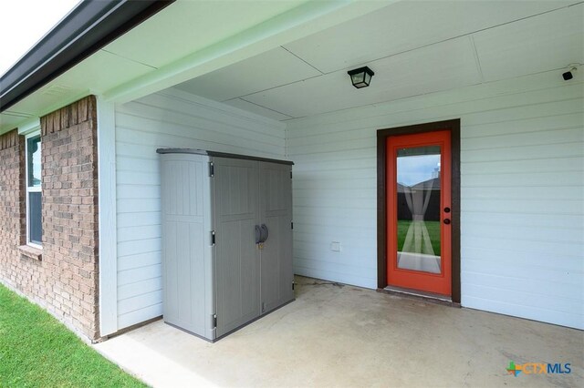 7202 Bose Ikard Dr, Killeen, TX 76549 - property entrance featuring a patio area and brick siding