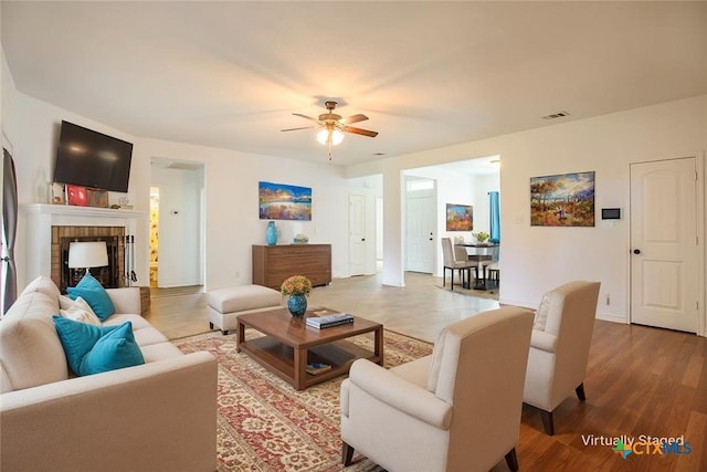 7202 Bose Ikard Dr, Killeen, TX 76549 - living room with a ceiling fan, wood finished floors, and a fireplace