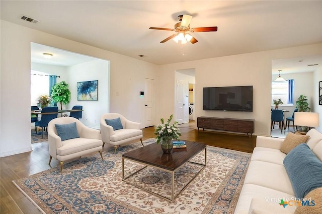 7202 Bose Ikard Dr, Killeen, TX 76549 - living room featuring ceiling fan, wood finished floors, and washer / clothes dryer