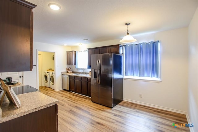 7202 Bose Ikard Dr, Killeen, TX 76549 - kitchen featuring stainless steel appliances, separate washer and dryer, dark brown cabinets, light countertops, and recessed lighting