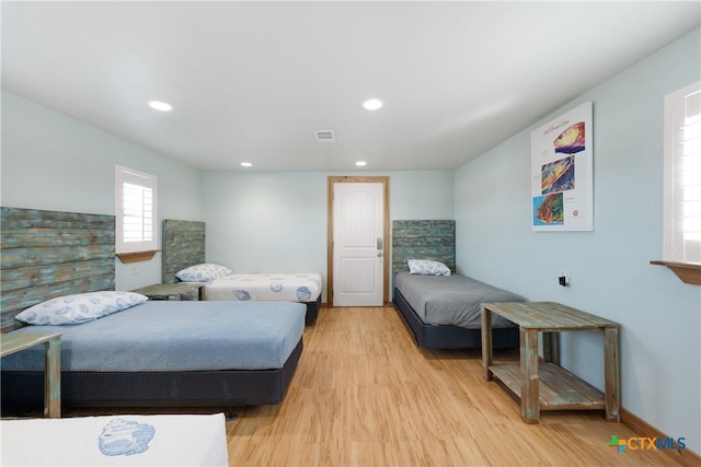 bedroom with light hardwood / wood-style floors