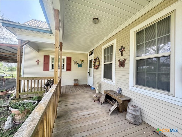 wooden deck featuring covered porch