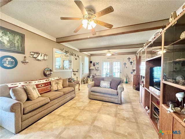 living area with a textured ceiling, french doors, beamed ceiling, and ceiling fan