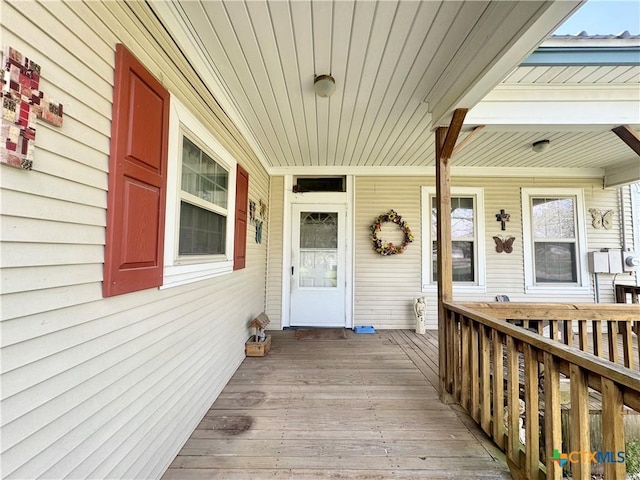 property entrance with covered porch