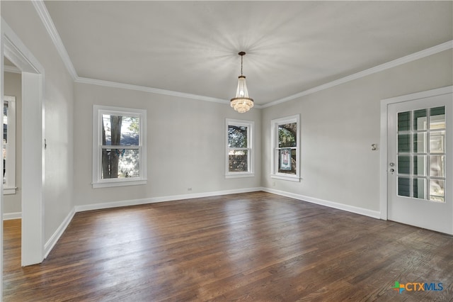 unfurnished room featuring ornamental molding, dark hardwood / wood-style floors, and an inviting chandelier