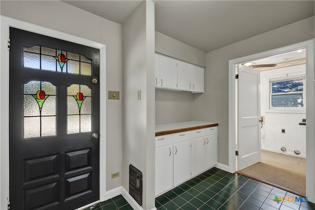 interior space featuring dark tile patterned flooring