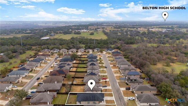 birds eye view of property with a residential view