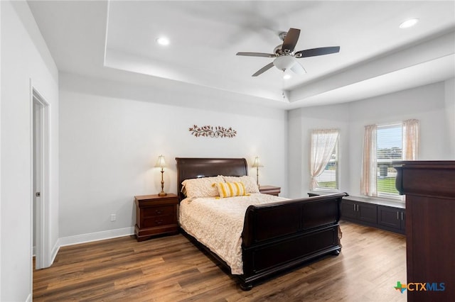 267 Oak View Dr, Inez, TX 77968 - bedroom with a tray ceiling, recessed lighting, wood finished floors, baseboards, and a ceiling fan