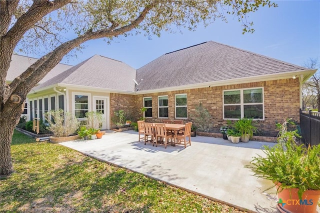 267 Oak View Dr, Inez, TX 77968 - rear view of house with a shingled roof, a patio, fence, and brick siding
