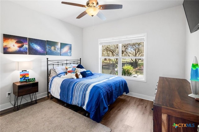 267 Oak View Dr, Inez, TX 77968 - bedroom featuring wood finished floors, baseboards, and a ceiling fan