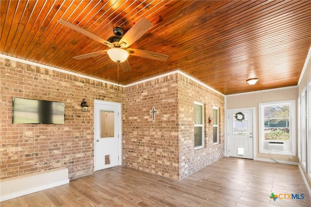 267 Oak View Dr, Inez, TX 77968 - foyer with wooden ceiling, ceiling fan, wood finished floors, brick wall, and cooling unit