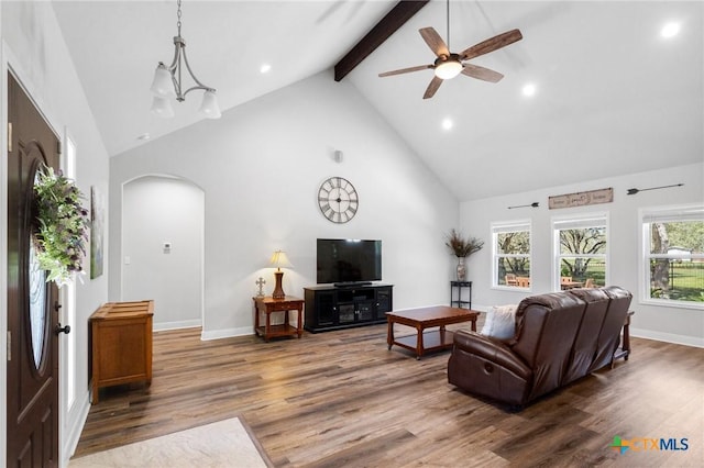 267 Oak View Dr, Inez, TX 77968 - living room with high vaulted ceiling, arched walkways, recessed lighting, wood finished floors, and beamed ceiling
