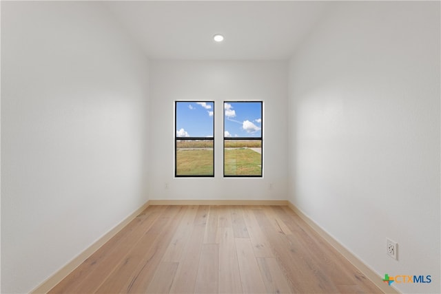 unfurnished room with light hardwood / wood-style floors