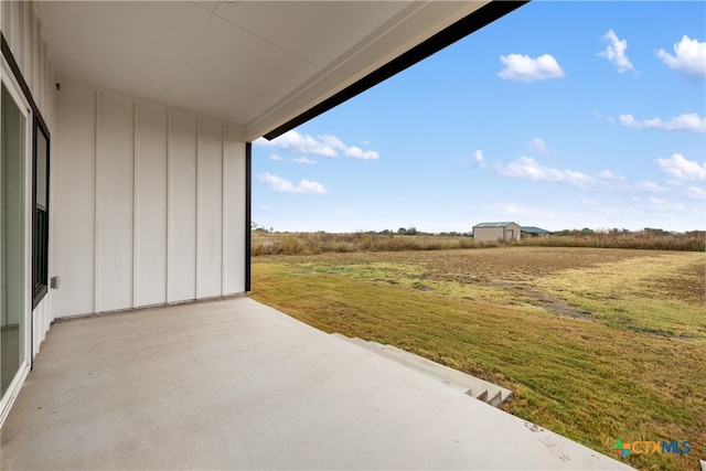 view of patio / terrace with a rural view