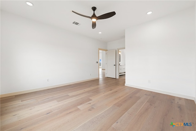 empty room featuring light wood-type flooring and ceiling fan