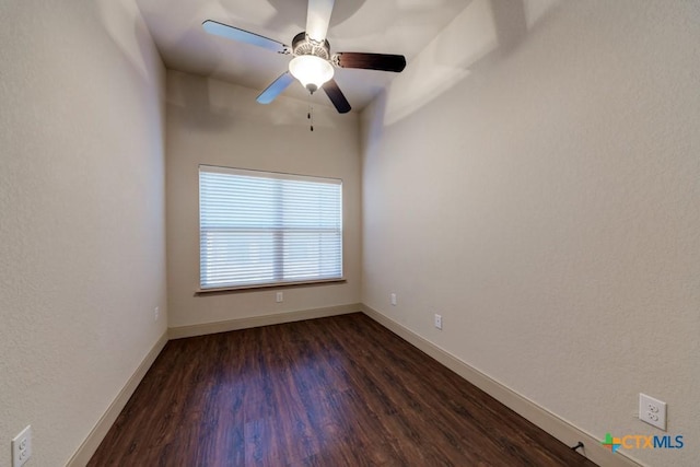 unfurnished room with ceiling fan and dark hardwood / wood-style flooring