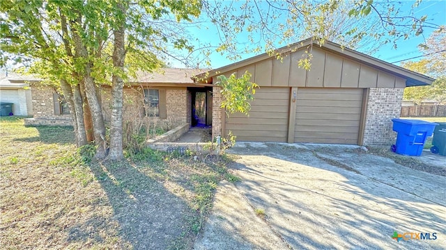 ranch-style home featuring a garage