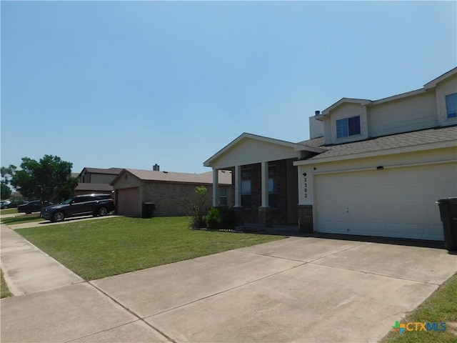 2302 Napier Dr, Killeen, TX 76542 - view of front of house featuring a front yard, concrete driveway, and a shingled roof