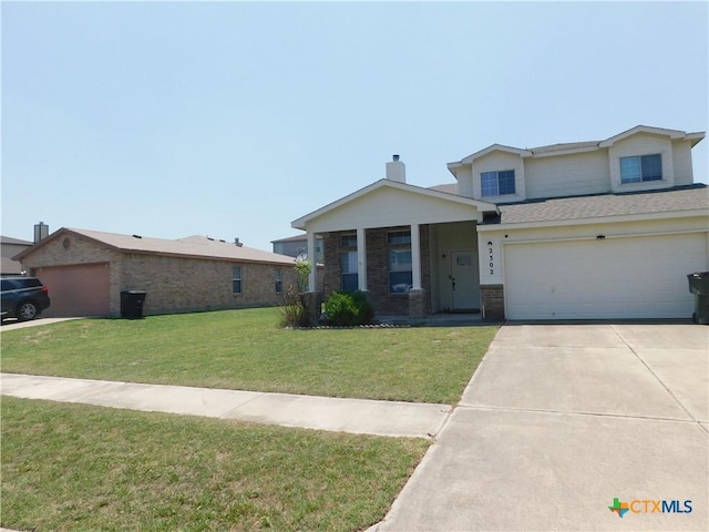 2302 Napier Dr, Killeen, TX 76542 - view of front of home with driveway, brick siding, a front lawn, and a garage