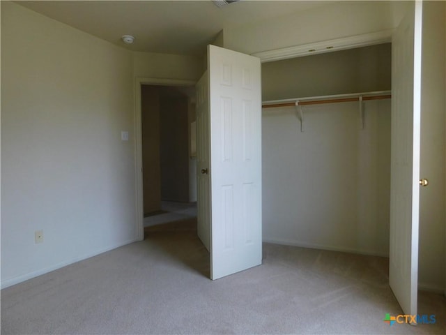 2302 Napier Dr, Killeen, TX 76542 - unfurnished bedroom with light colored carpet, a closet, and baseboards