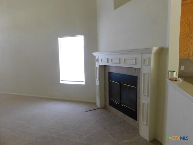 2302 Napier Dr, Killeen, TX 76542 - detailed view of a tiled fireplace, carpet, and baseboards