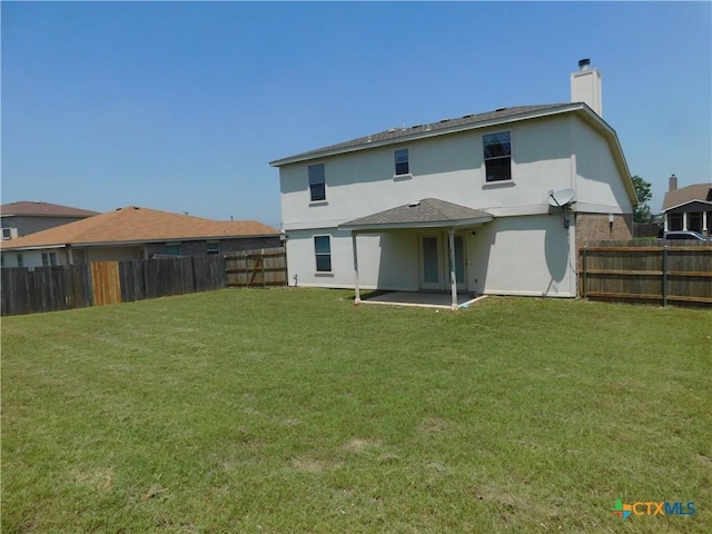 2302 Napier Dr, Killeen, TX 76542 - back of house featuring a chimney, a patio area, and stucco siding