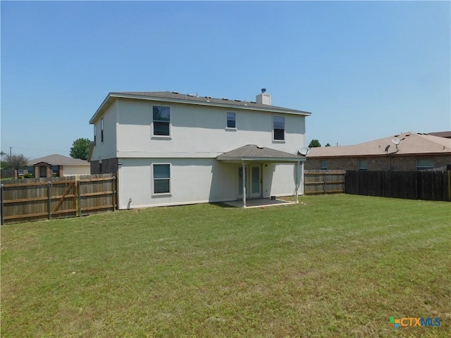 2302 Napier Dr, Killeen, TX 76542 - rear view of property with a chimney, stucco siding, and a patio