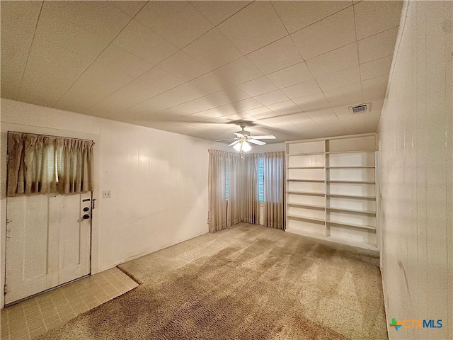 unfurnished room featuring carpet flooring and ceiling fan