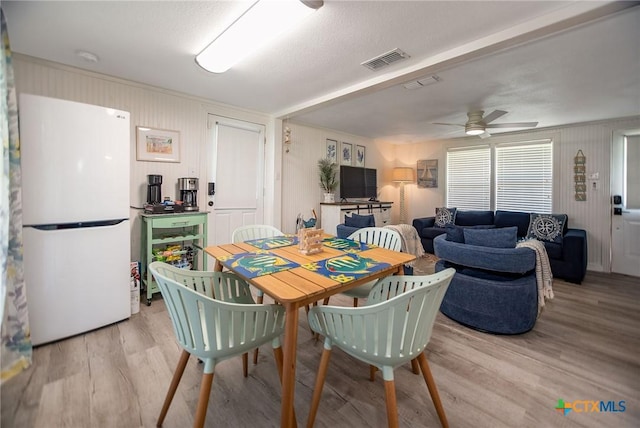 819 S Magnolia St, Rockport, TX 78382 - dining area featuring light wood-style flooring and ceiling fan