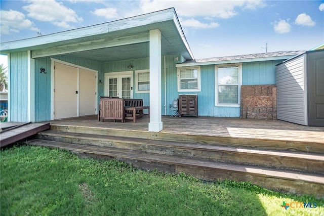819 S Magnolia St, Rockport, TX 78382 - deck featuring french doors
