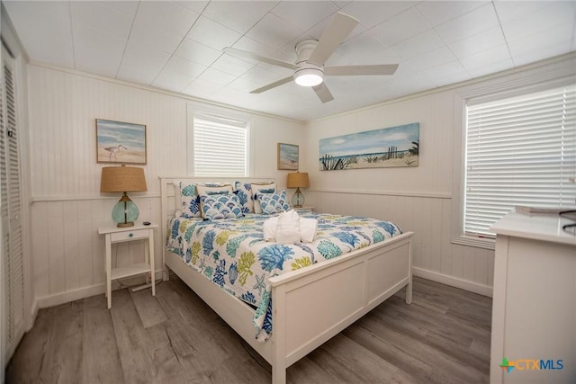 819 S Magnolia St, Rockport, TX 78382 - bedroom with wood finished floors and a ceiling fan