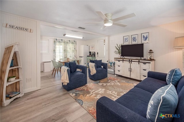 819 S Magnolia St, Rockport, TX 78382 - living area featuring ceiling fan and wood finished floors