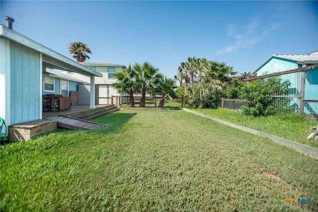 819 S Magnolia St, Rockport, TX 78382 - fenced backyard featuring a deck