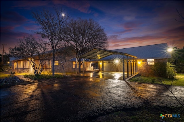 view of front of property featuring aphalt driveway