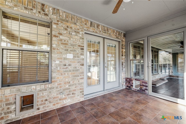 property entrance with french doors and a ceiling fan