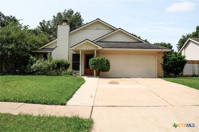 22631 John Rolfe Ln, Katy, TX 77449 - ranch-style home with a garage, a front yard, concrete driveway, a shingled roof, and brick siding