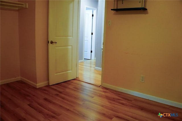 22631 John Rolfe Ln, Katy, TX 77449 - unfurnished bedroom featuring light wood-style floors and baseboards