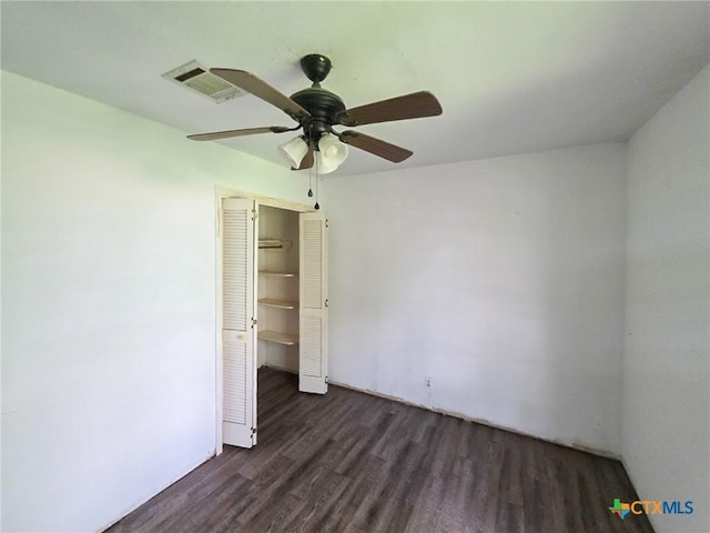 403 Schell Rd, Victoria, TX 77904 - unfurnished bedroom with wood finished floors, a closet, and ceiling fan