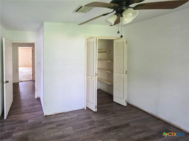 403 Schell Rd, Victoria, TX 77904 - unfurnished bedroom featuring a closet, dark wood-type flooring, and a ceiling fan